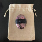 Rhodonite Palm Stone Wrapped With Sea Glass Bead