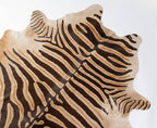 Wild Zebra Stripes on Beige Cowhide Rug